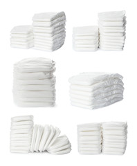 Set of baby diapers on white background