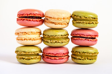 Assortment of delicious traditional french macaroons. Colorful sweet dessert for real gourmands. White background, close up, macro.