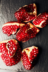 Pomegranate juice on a dark background. Summer drink. Pomegranate on a dark background.