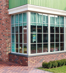 Street glass showcase cafe red brick facade