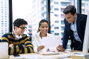 The teamwork of the new generation of business people on the table in the meeting room.