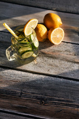 Lemonade on a light background. Summer refreshing drink.