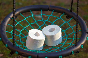 Two rolls of toilet paper are in the basket