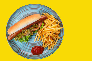 Hot dog with French fries and sauce