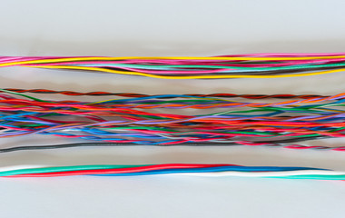 Multicolored wires on a white background.