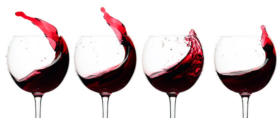 Splashes of red wine in a glasses isolated on  white.