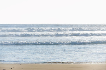 parallel rows of ocean waves coming to a beach. beautiful pacific coastal seascape in bright colors near Tofino. Canada © Alena Charykova