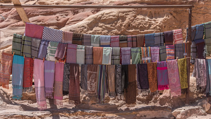 Colorful head scarves, arabic fabric. Products, souvenirs for tourists in Petra, Jordan. Beautiful...