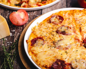 Freshly baked Pepperoni Pizza loaded with a variety of cheese and herbs