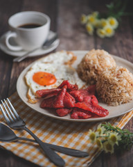 Tosilog is a typical Filipino Breakfast, consisting usually of cured pork meat, fried egg and fried rice. 