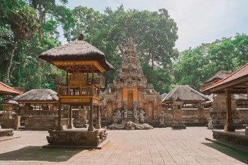An empty Hindu temple in Bali. Traditional architecture and sculptures in a Hindu temple. Balinese temple in the jungle. Sunny weather.