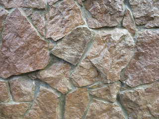   texture of stone on wall of different rocks 