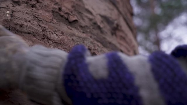 A man fixing chimney with clay