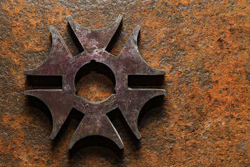 Rusty steel six-pointed star or cross