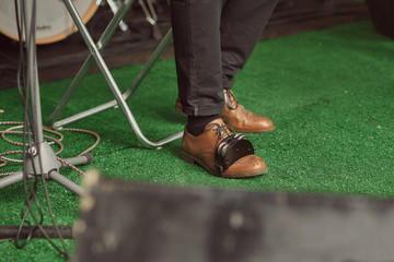 tambourine on the foot of a musician