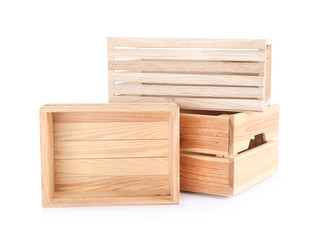 Empty wooden crates stacked and isolated on white