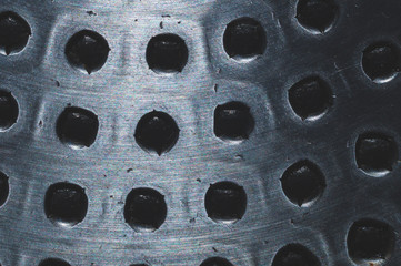 Steel plate with holes close up. abstract industrial background
