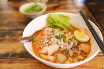 Thai traditional spicy seafood noodles or Tom Yum
