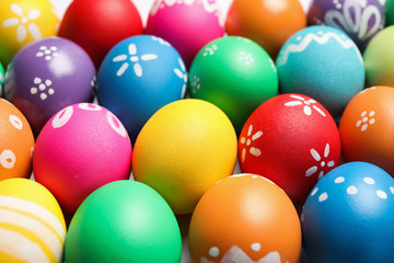 Colorful Easter eggs with different patterns as background, closeup