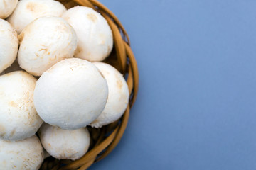 A lot of porcini mushrooms in a wicker plate.
