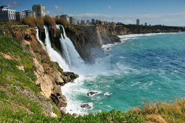 Obraz premium Waterfall on city coast close-up. Travel, beauty, sea