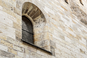 Old window on stone wall.