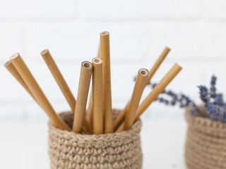 reusable bamboo drink cans in a jute basket, preserve nature without plastic. close-up