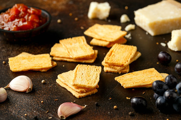 Cheese Crispies with garlic, parmesan, grape and chutney. party food snacks