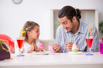 Father celebrating birthday with his daughter