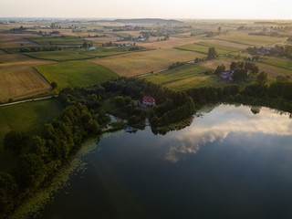Fototapeta na wymiar Sitno Lake Kujawsko Pomorskie Poland Filds Country Farm Sunset