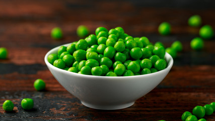 Green peas in white bowl. Healthy food