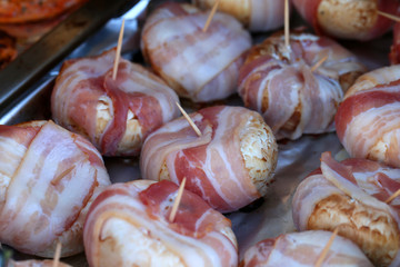 Traditional Finnish summer cottage food every Finn loves to enjoy during midsummer fest and summertime in general. Delicious homemade grilled mushroom filled with cream cheese and wrapped in bacon.