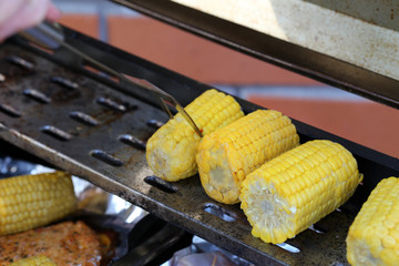 Traditional Finnish summer cottage food every Finn loves to enjoy during midsummer fest and summertime in general. Delicious homemade barbeque corn. Healthy and fresh yet yummy vegetable from grill.