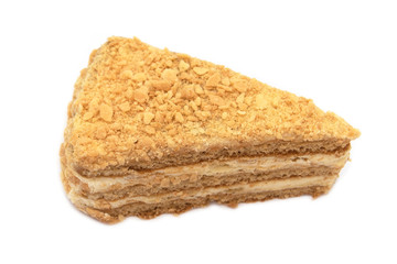Slice of Honey Cake with cream isolated on white Background