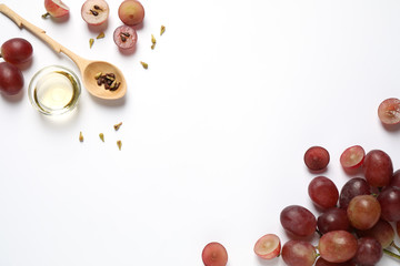 Composition with natural grape seed oil on white background, top view. Organic cosmetic