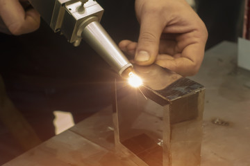 Fiber laser welding. Manual laser welding of metal - obrazy, fototapety, plakaty