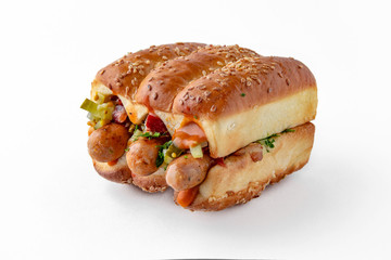 Huge hot dog burger with sausages from minced meat vegetables and herbs. For take away or food delivery isolated on a white background.
