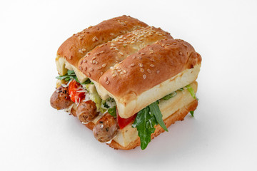 Huge hot dog burger with sausages from minced meat vegetables and herbs. For take away or food delivery isolated on a white background.