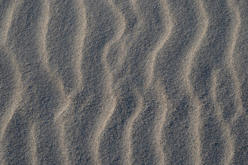 Fototapeta na wymiar Sand texture background with wave pattern
