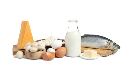 Fototapeta na wymiar Fresh products rich in vitamin D on white background