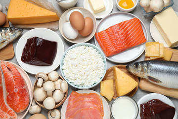Fresh products rich in vitamin D on table, flat lay