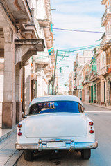 View of yellow classic vintage car in Old Havana, Cuba