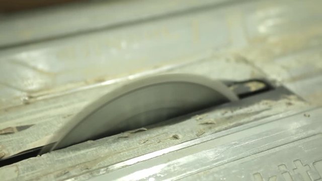 Worker cutting wooden with woden cuter. Close up shoting