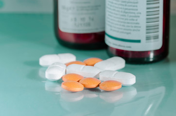 pills against viruses and pathogens on a  green table 