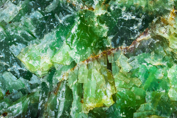 The grunge green and yellow rock jade background. 