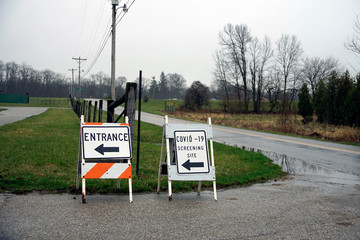 signs marking the Covid-19 screening site entrance in Cass county Indiana