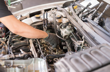 Repairing car engine in the garage