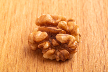 walnut kernel on wooden background