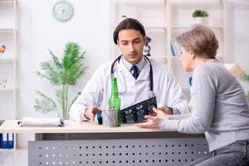 Female alcoholic visiting young male doctor