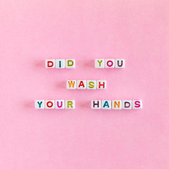 Phrase Did You Wash Your Hands from colorful beads on pink background, hygiene concept